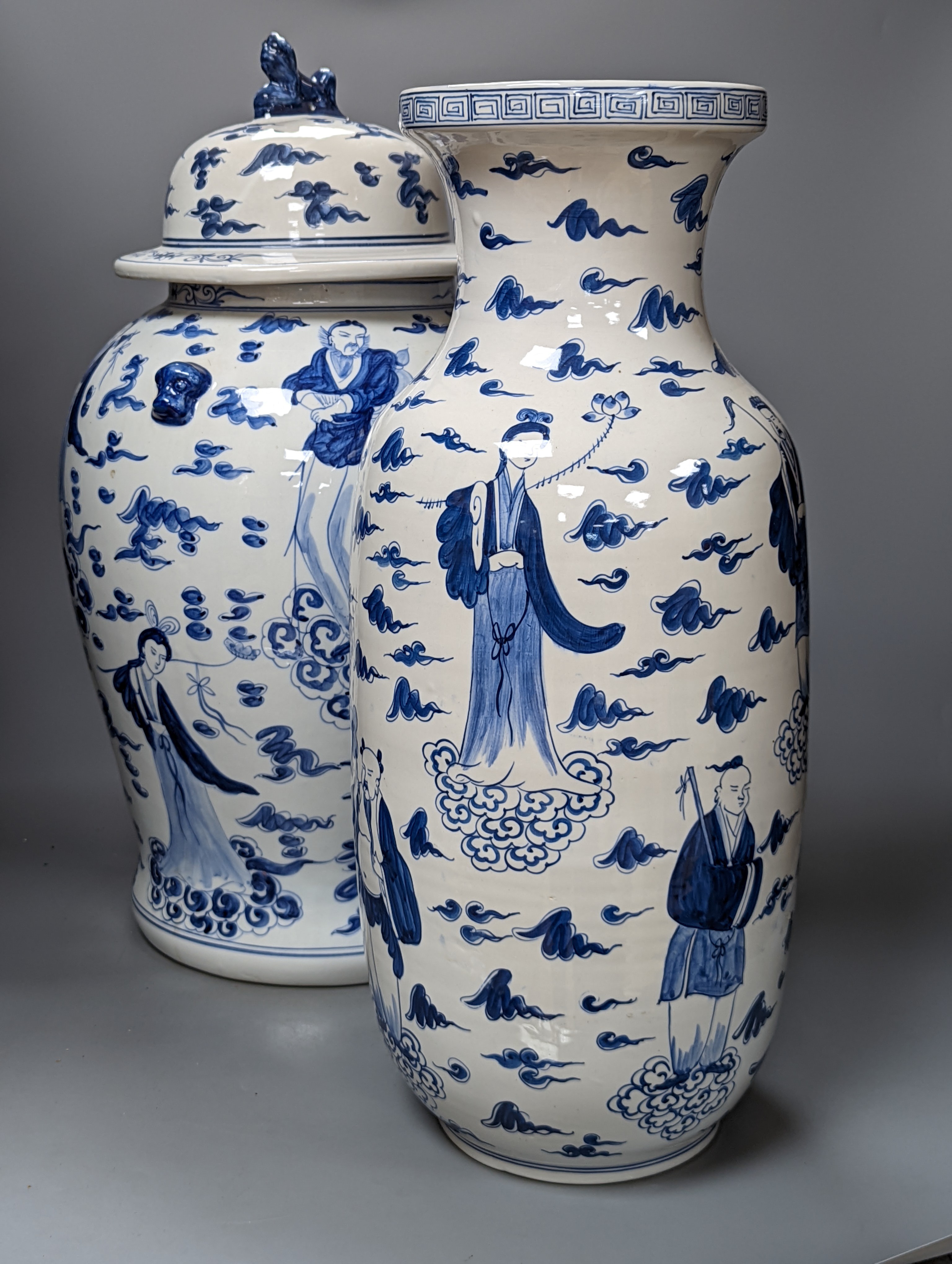 A large Chinese blue and white baluster jar and cover and matching vase, tallest 55 cms high.